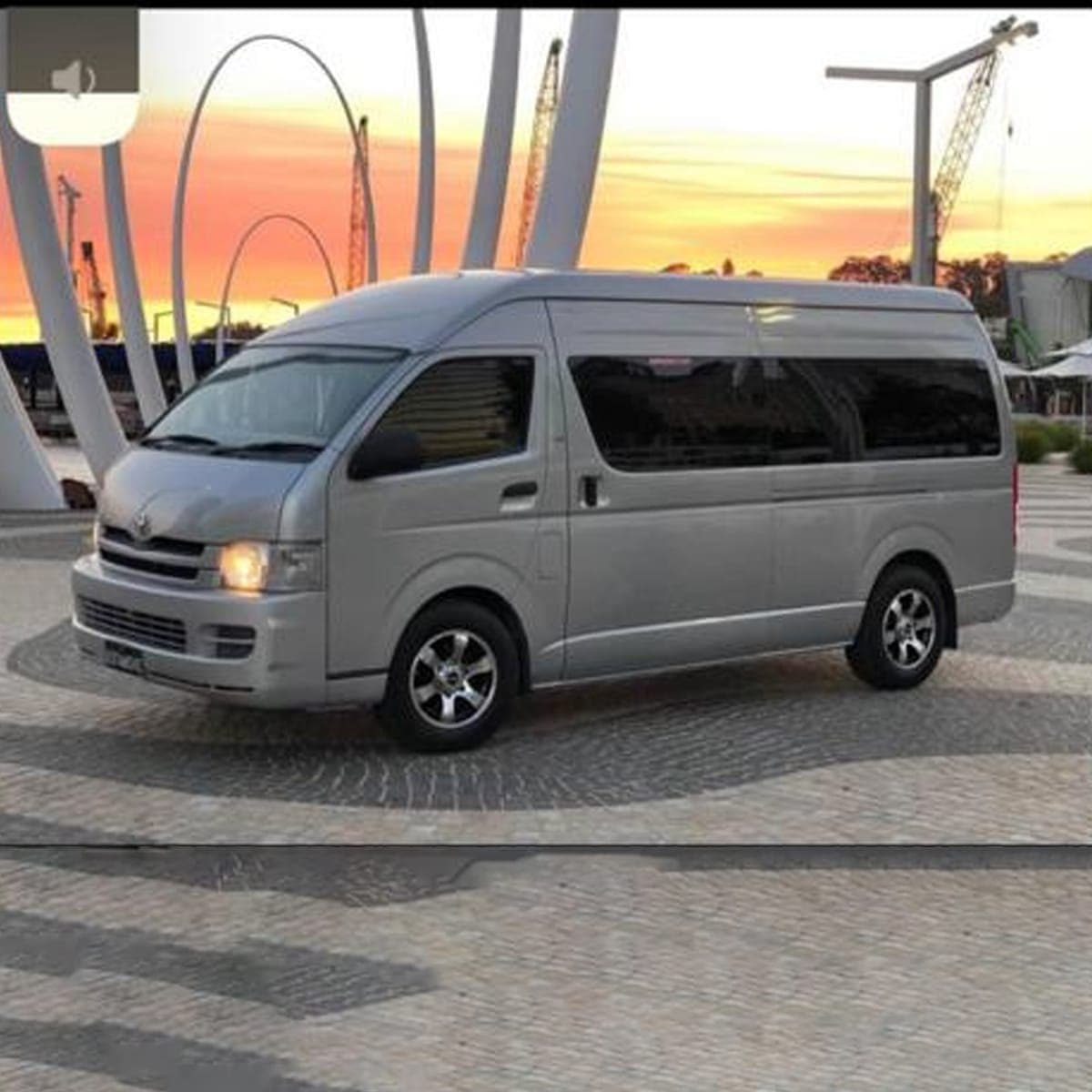The 14 seater party limo parked at sunset