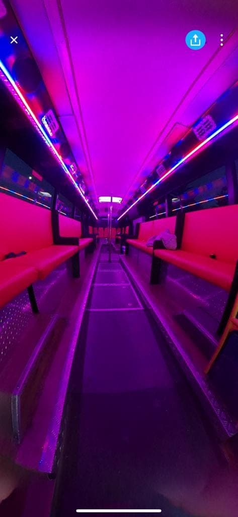 Interior of the 40 seater party bus with the lights running