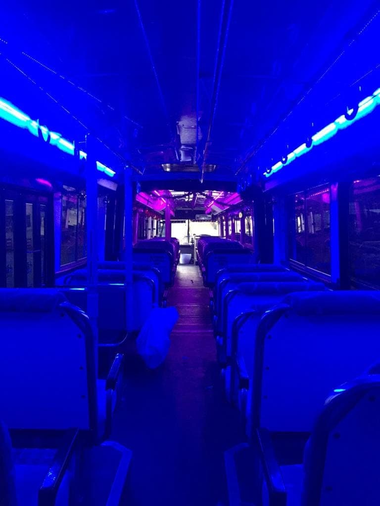 Interior of the 70 seater party bus under blue lighting